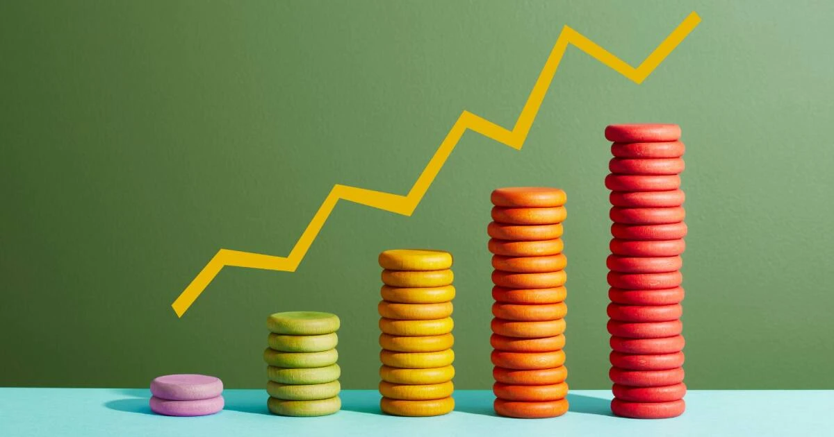Stacks of colored discs rising from left to right with an upward trend line